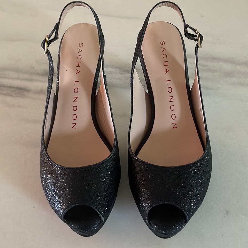 Black glitter open toe heels.